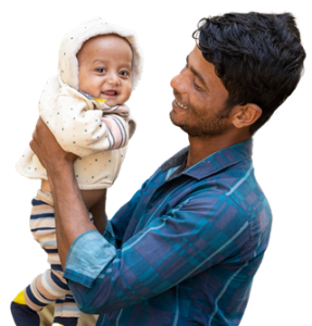A man looks at a baby he is holding. Both are smiling.