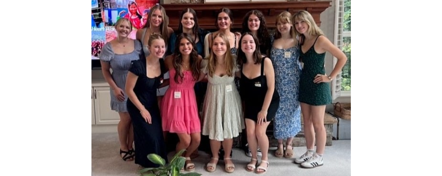 The young women of the Woodinville High School Chapter pose and smile at the camera