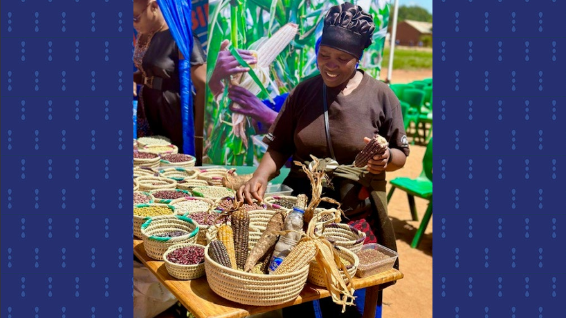 Rehema, a participant with Transformation Partner, Landesa, smiles as she looks down at a table of woven baskets at an open air market