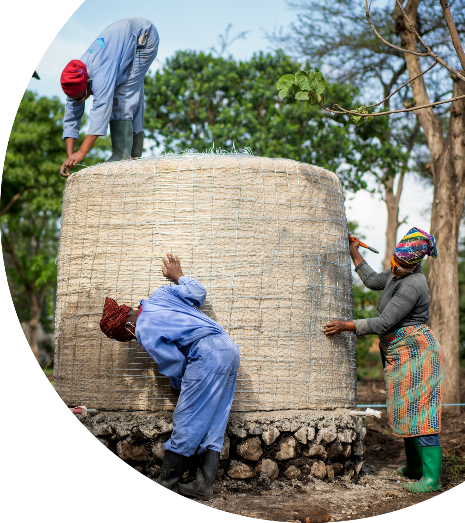 women building rainwater harvesting system